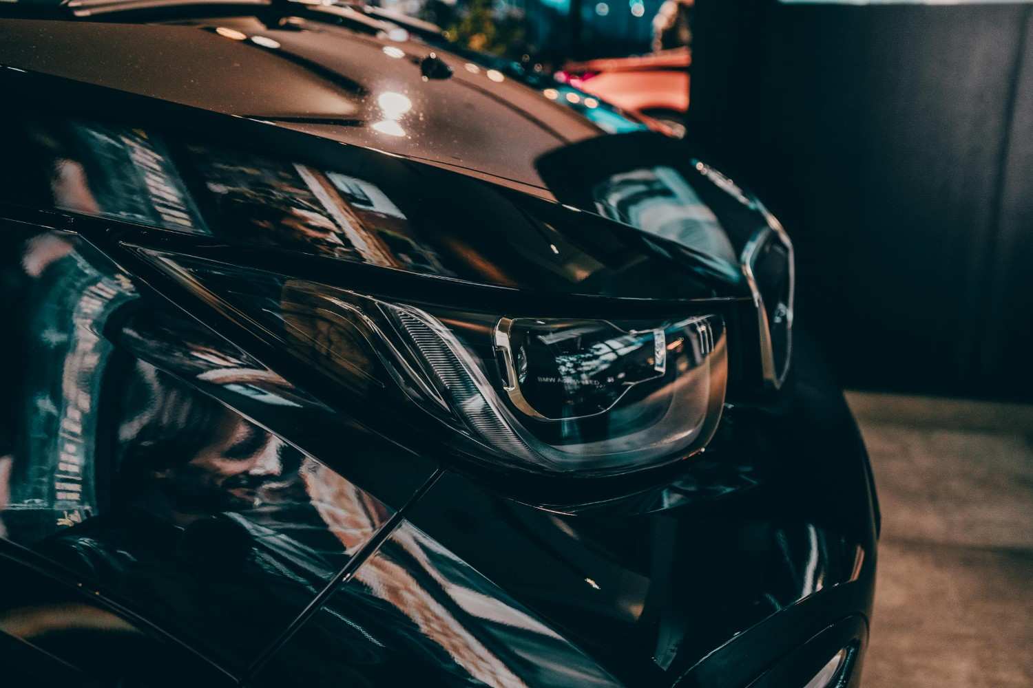 Close up of a modern luxury car headlights symbolizing precision insurance
